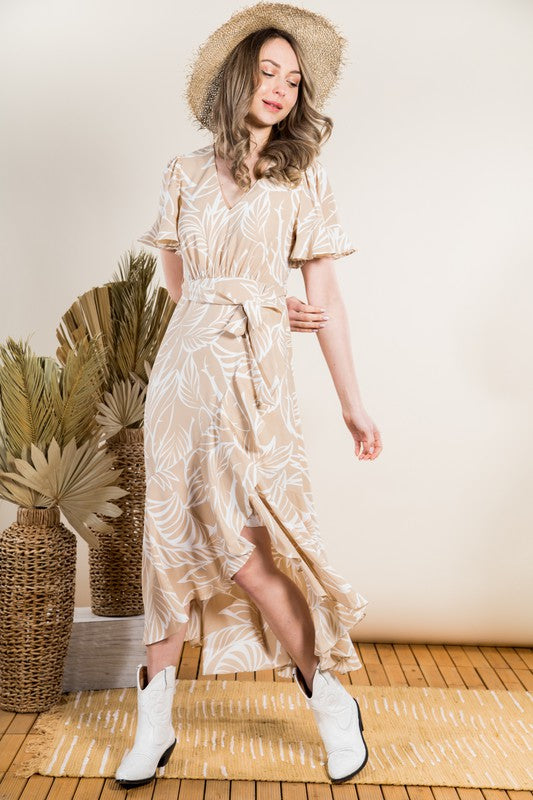 Tropical leaf printed asymmetrical maxi dress Elizabeth's Boutique Tropical leaf printed asymmetrical maxi dress Elizabeth's Boutique